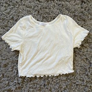 Cute white crop top, flavored bottom and sleeves.